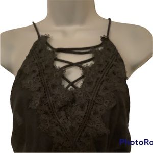 Halter top style jumpsuit. Black Sz M. Figure flattering.